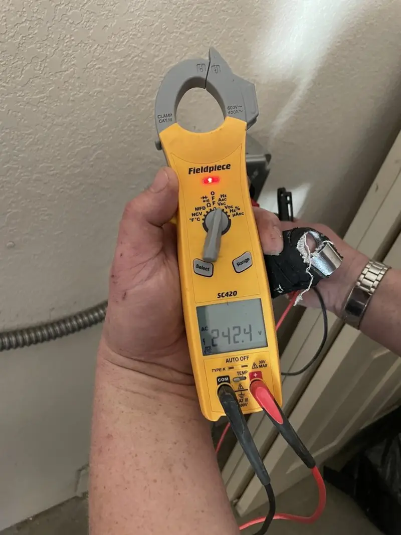 Voltage testing with clamp meter during Electrical Installation Services in Tukwila
